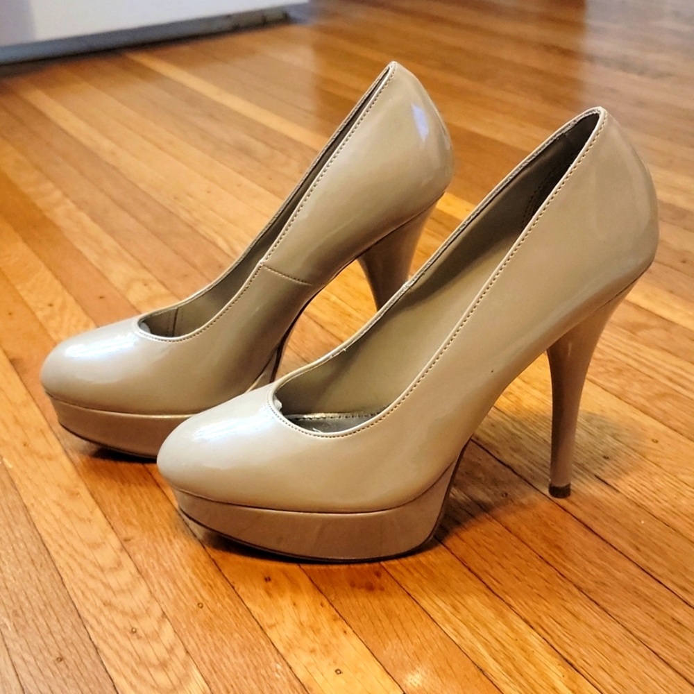 Size 10 tan stilletos, 5 in heel, barely worn.